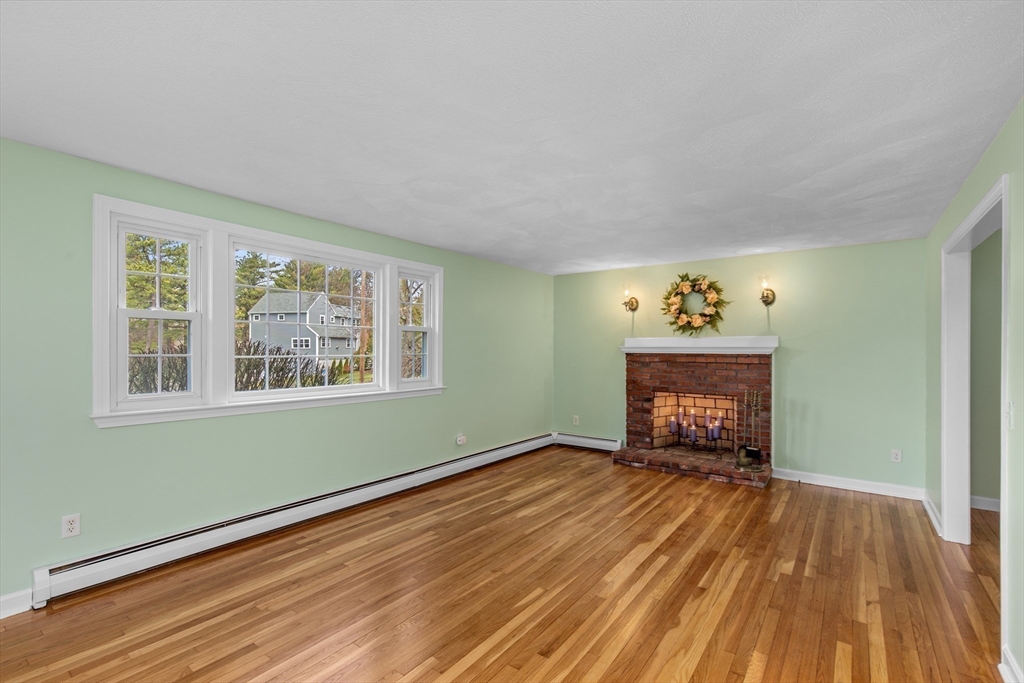 15 Massasoit Circle Walpole, MA 02032 - Photo 3 of 34 wooden floor in an empty room with a window