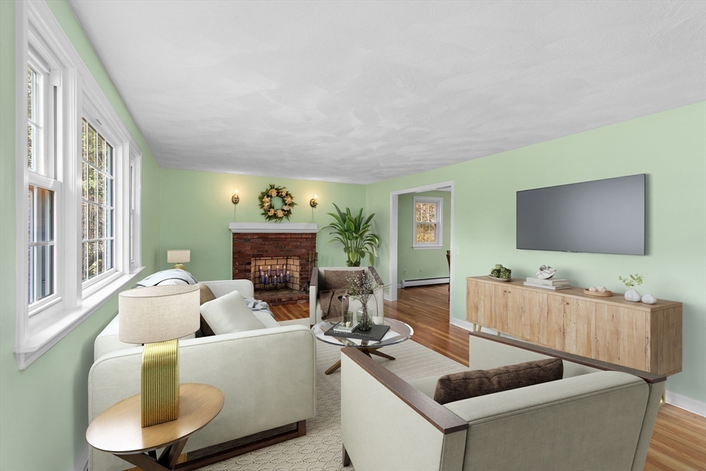 15 Massasoit Circle Walpole, MA 02032 - Photo 4 of 34 a living room with furniture and a flat screen tv