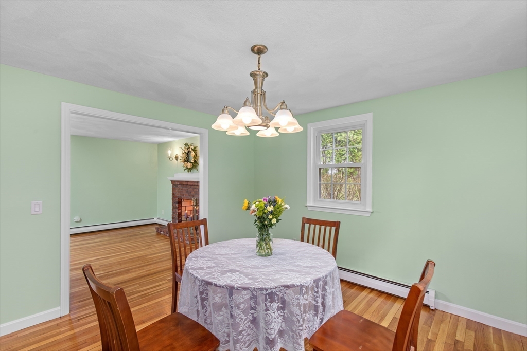 15 Massasoit Circle Walpole, MA 02032 - Photo 6 of 34 a dining room with furniture a chandelier and wooden floor