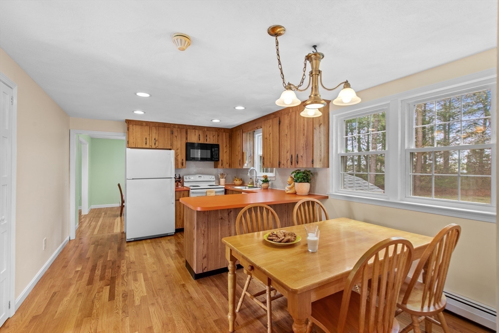 15 Massasoit Circle Walpole, MA 02032 - Photo 8 of 34 a view of a dining room with furniture window and wooden floor