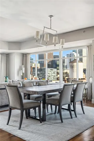 a view of a dining room with furniture window and wooden floor