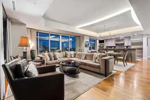 a living room with furniture window and lamp