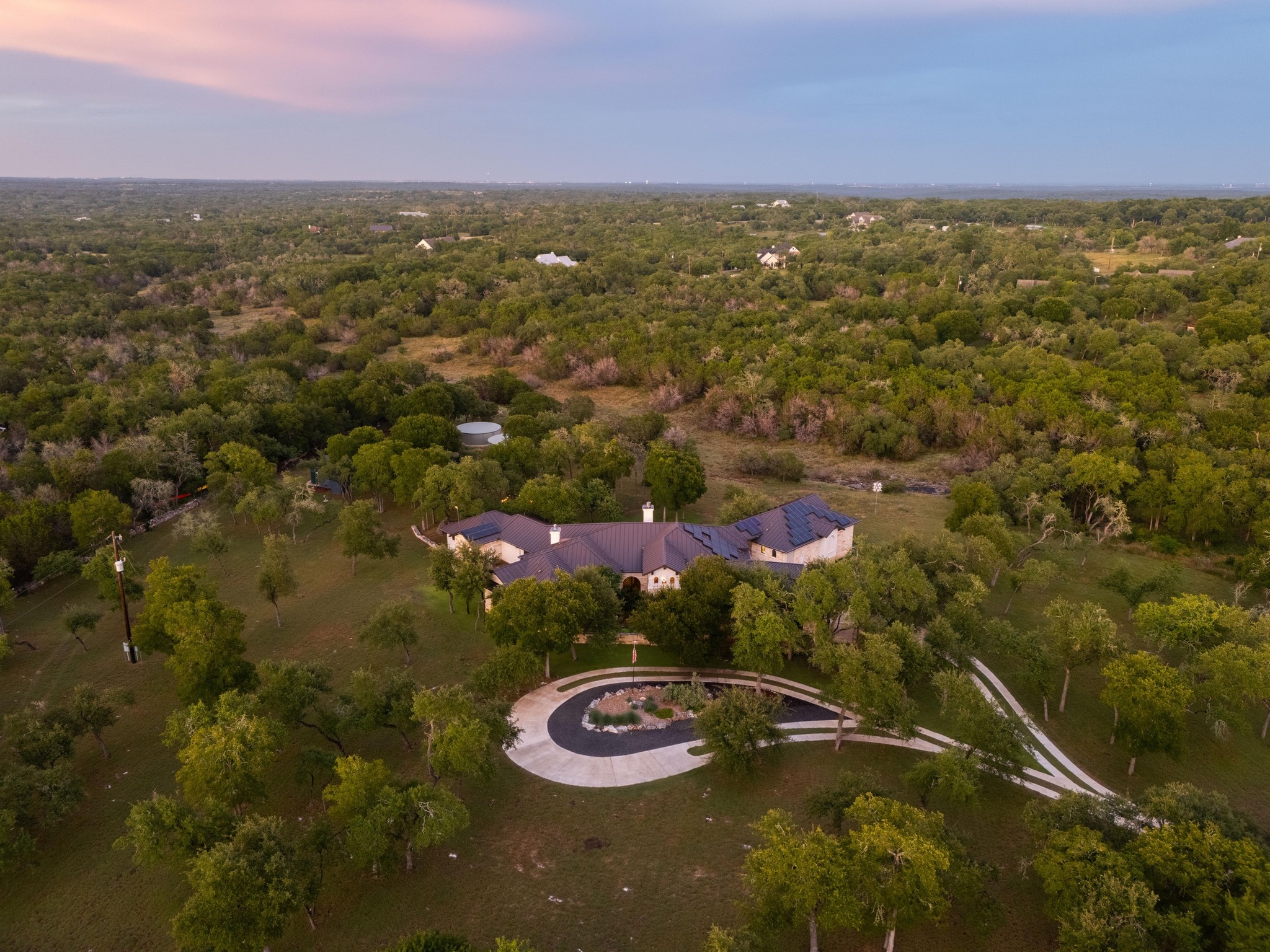 401 Trail Ridge Road Wimberley, TX 78676 - Photo 1 of 1 Aerial view of property's location featuring a forest