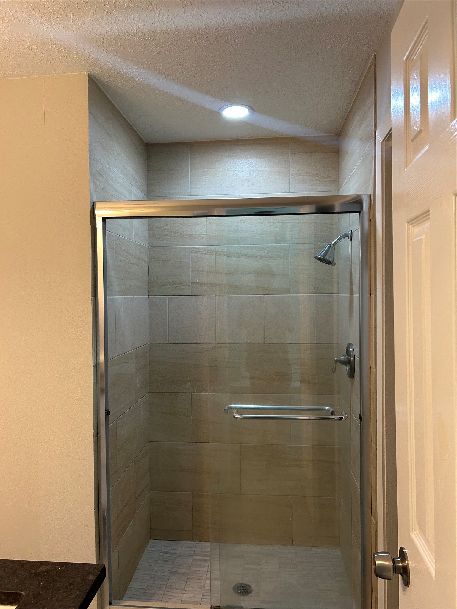 11719 Pender Lane Houston, TX 77477 - Photo 14 of 21 a bathroom with a glass door shower