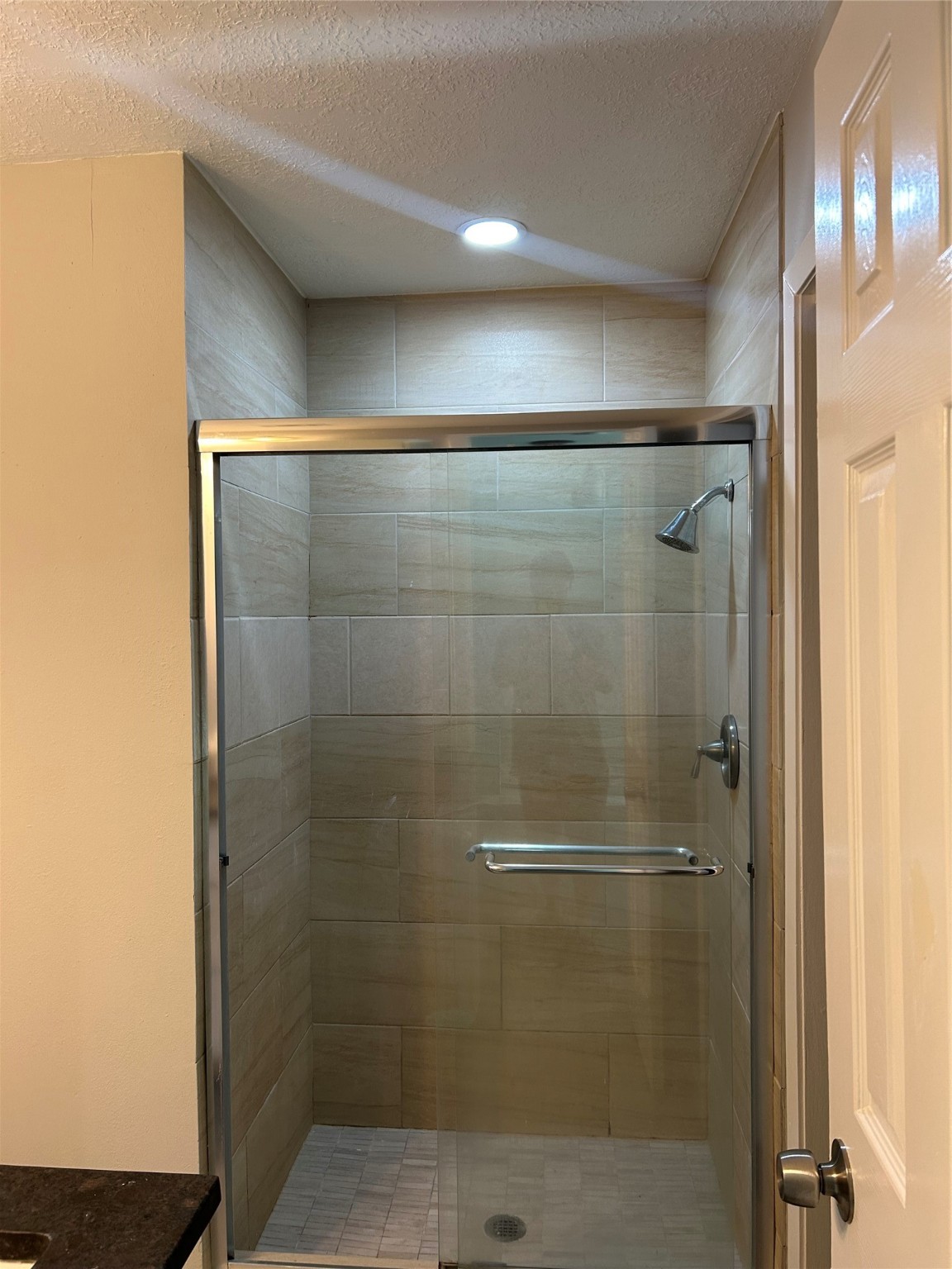 11719 Pender Lane Houston, TX 77477 - Photo 14 of 21 a bathroom with a glass shower door