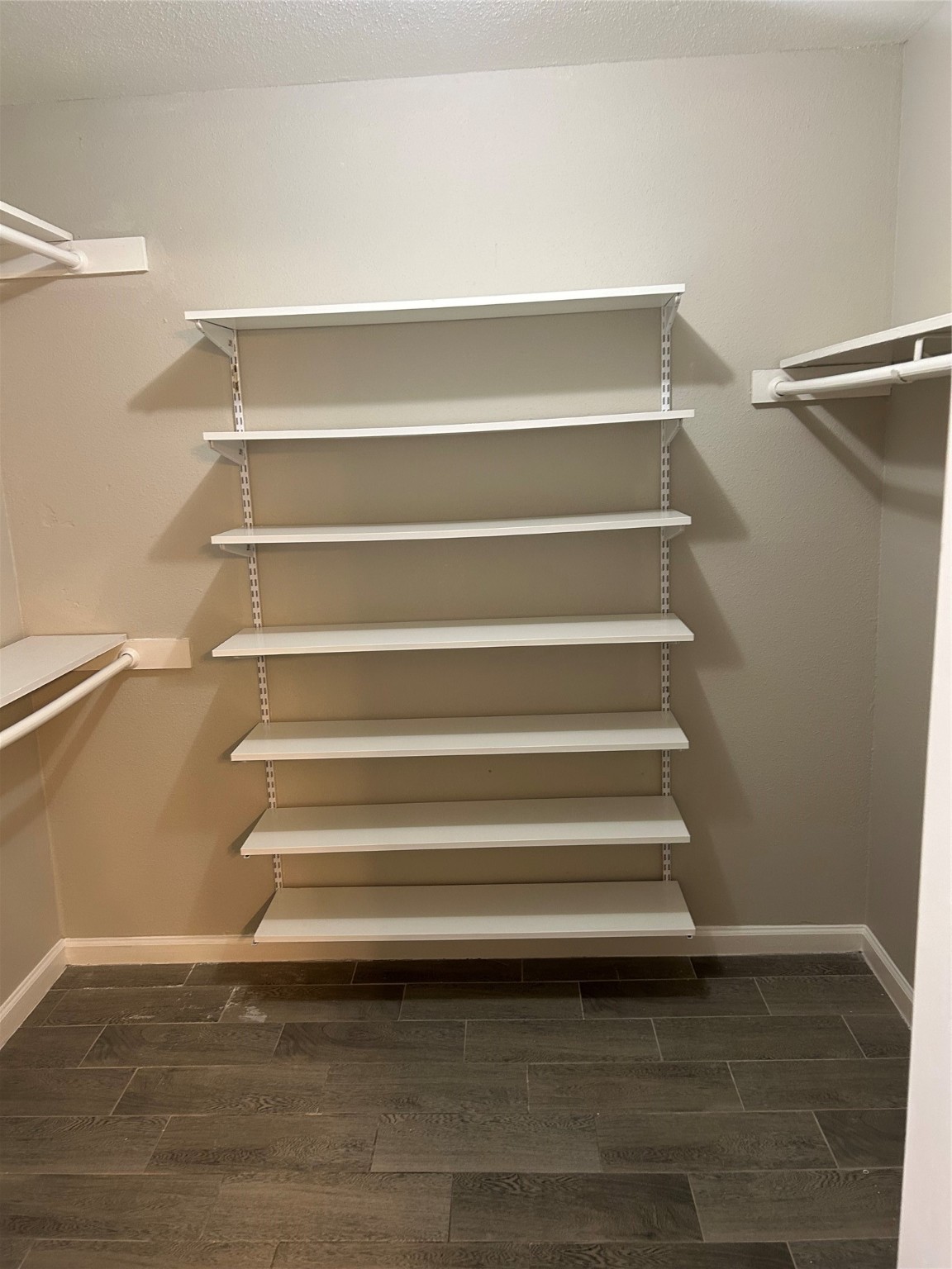 11719 Pender Lane Houston, TX 77477 - Photo 15 of 21 a view of walk in closet with empty racks