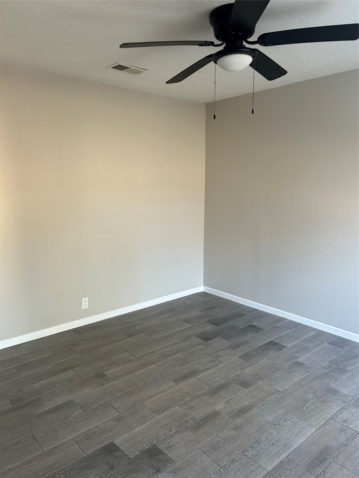 11719 Pender Lane Houston, TX 77477 - Photo 17 of 21 a view of an empty room with wooden floor