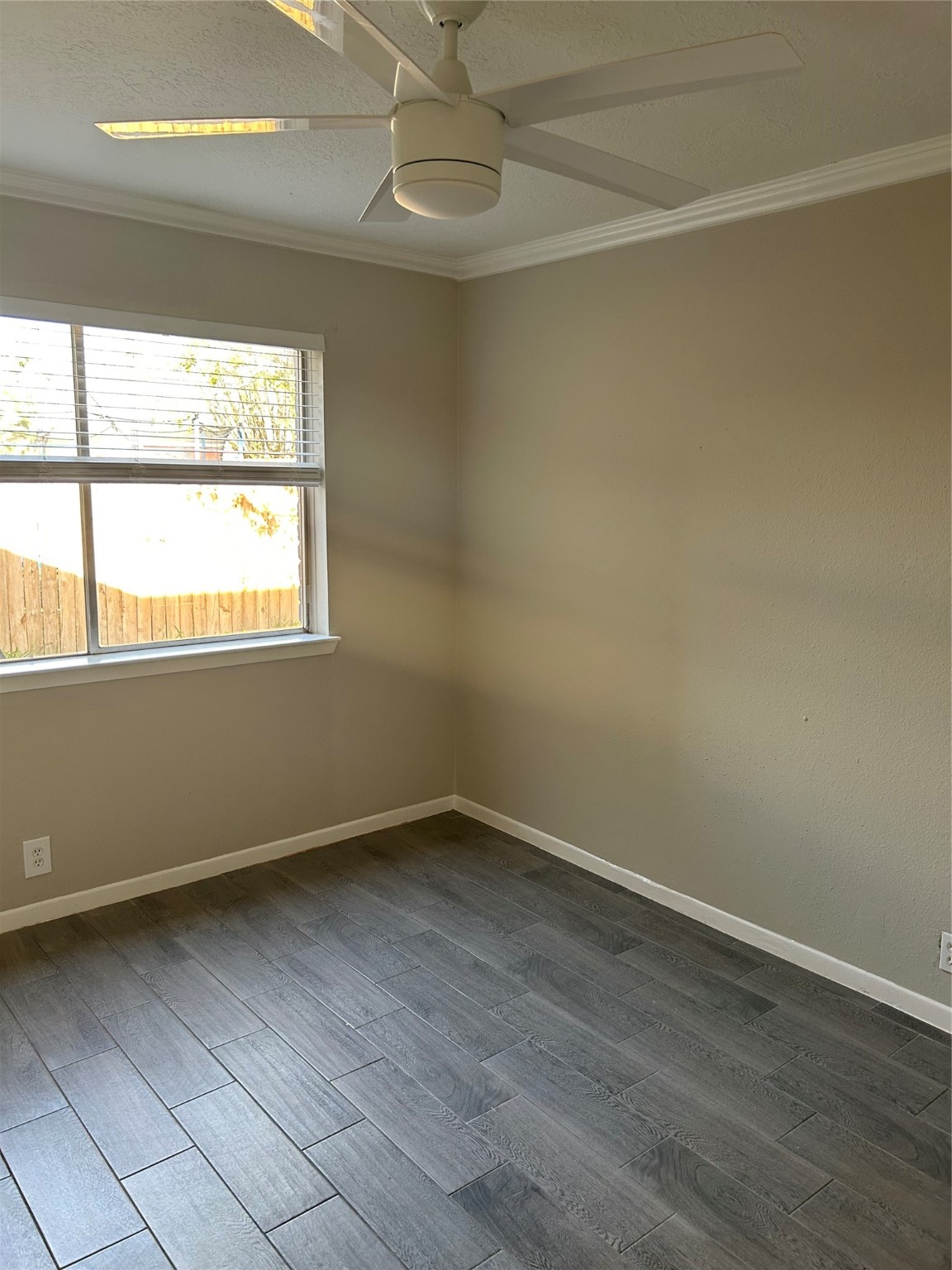 11719 Pender Lane Houston, TX 77477 - Photo 19 of 21 an empty room with wooden floor and windows