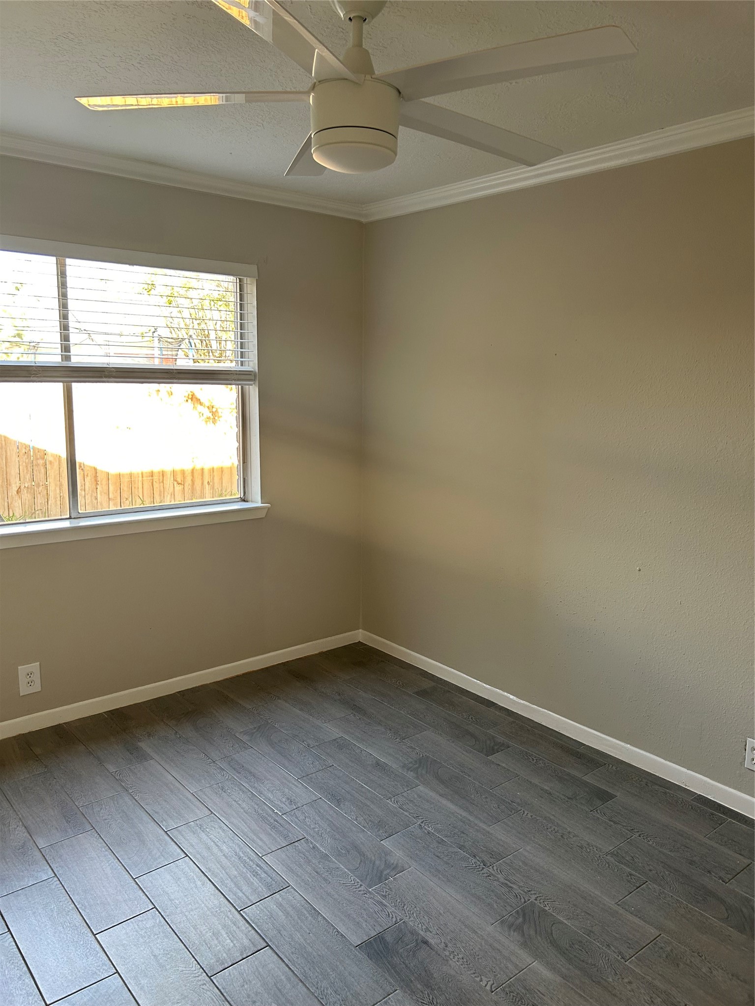 11719 Pender Lane Houston, TX 77477 - Photo 19 of 21 an empty room with wooden floor and windows