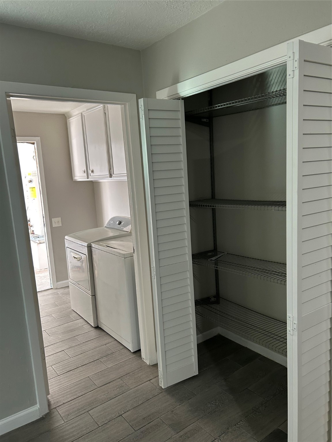 11719 Pender Lane Houston, TX 77477 - Photo 21 of 21 a view of walk in closet with empty racks