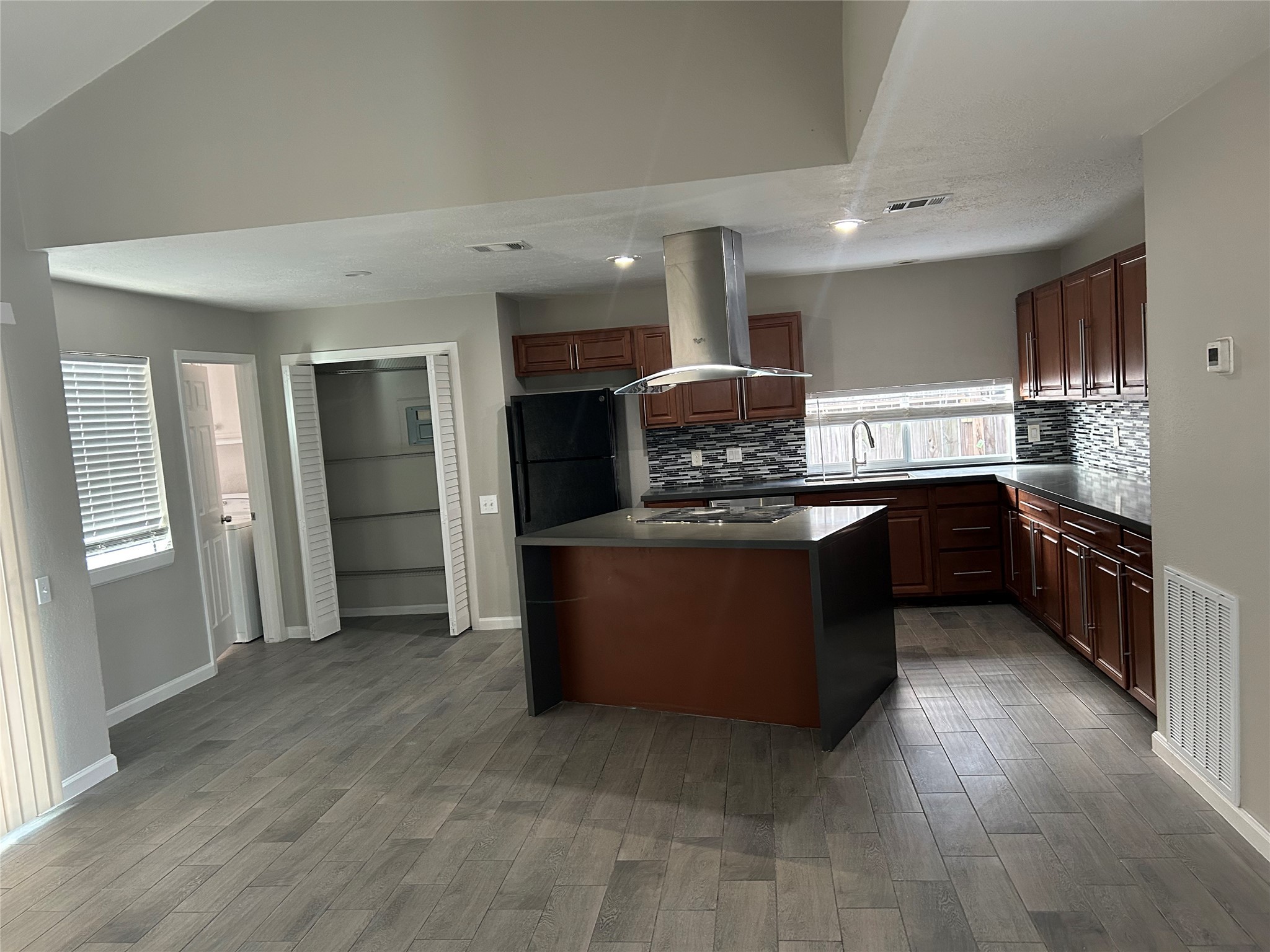 11719 Pender Lane Houston, TX 77477 - Photo 7 of 21 a kitchen with stainless steel appliances granite countertop a stove a sink and a refrigerator