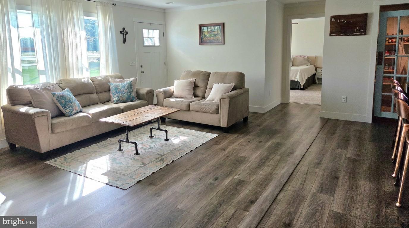 6924 Williamsburg Church Road Hurlock, MD 21643 - Photo 14 of 29 Living Room into Primary Bedroom