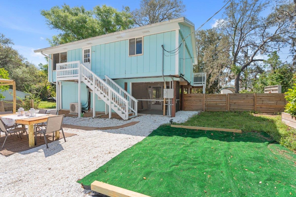 507 Gerona Road St. Augustine, FL 32086 - Photo 12 of 23 a view of backyard with table and chairs wooden fence
