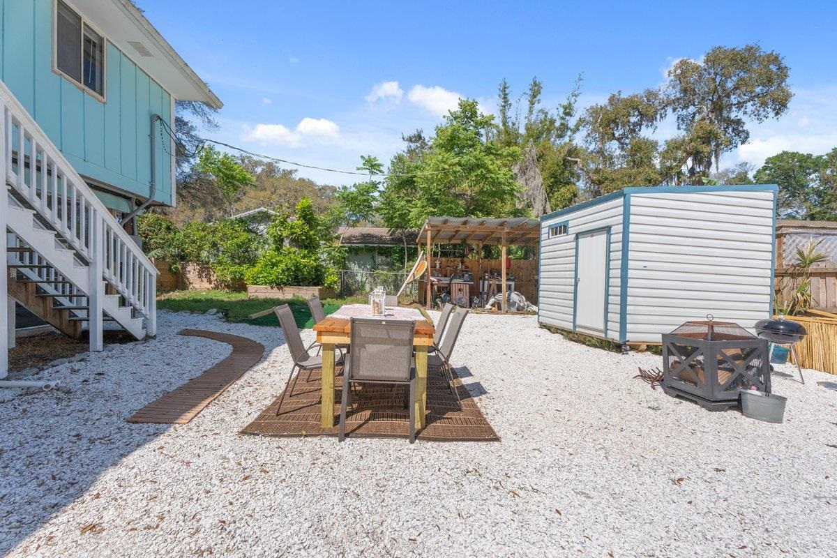 507 Gerona Road St. Augustine, FL 32086 - Photo 16 of 23 a view of a patio with a table and chairs