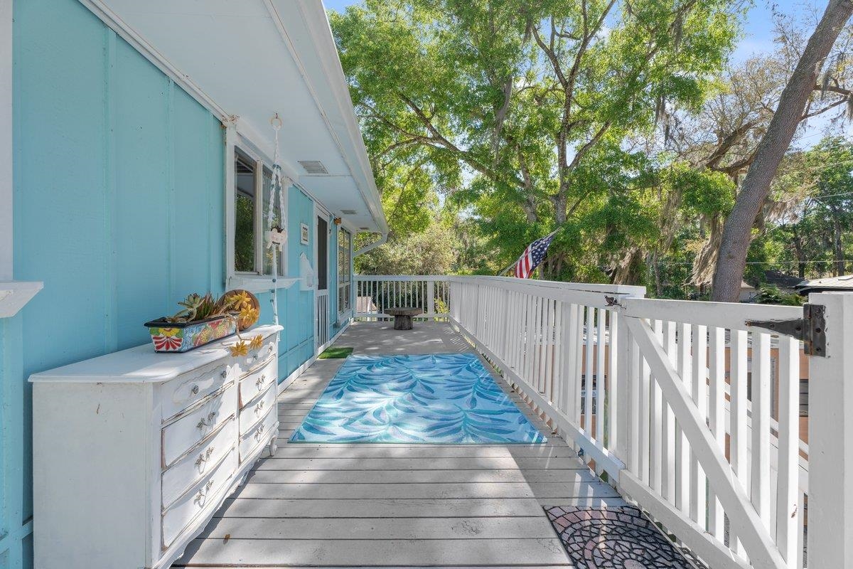 507 Gerona Road St. Augustine, FL 32086 - Photo 19 of 23 a view of a porch with wooden floor and fence