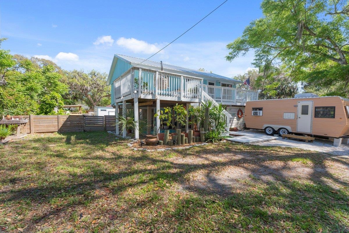 507 Gerona Road St. Augustine, FL 32086 - Photo 20 of 23 a view of a house with a yard