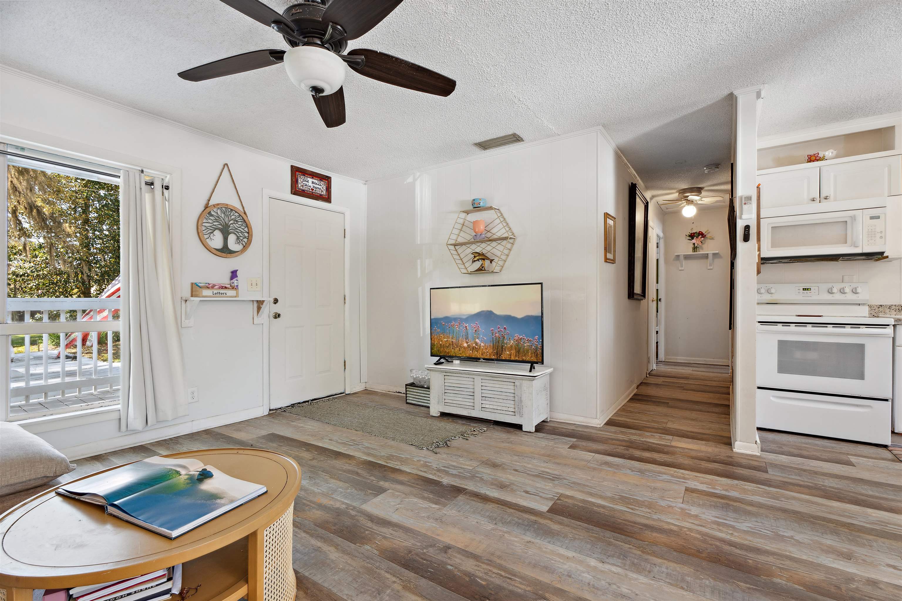 507 Gerona Road St. Augustine, FL 32086 - Photo 2 of 23 a view of a hallway with entryway wooden floor and front door
