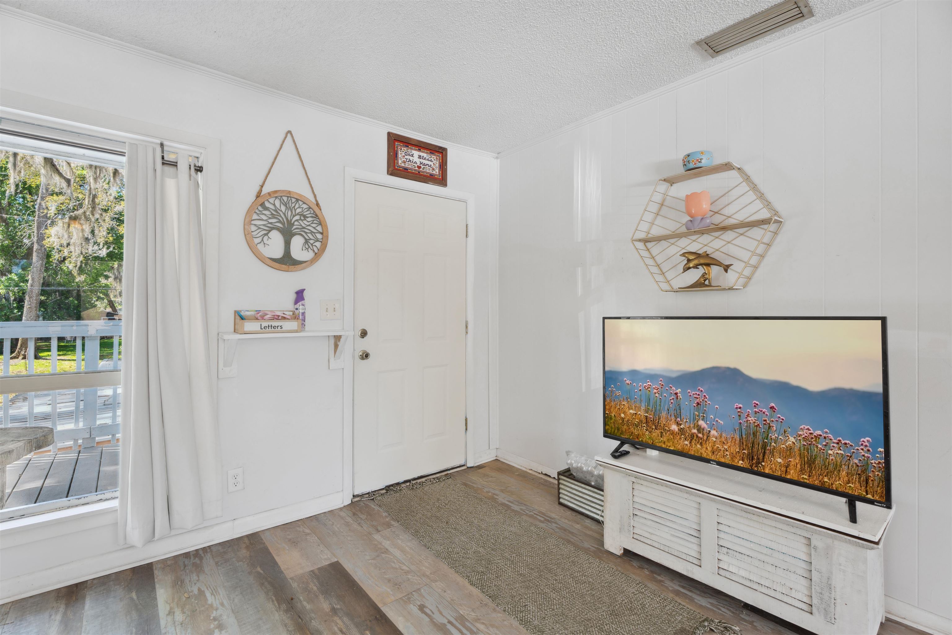 507 Gerona Road St. Augustine, FL 32086 - Photo 3 of 23 a view of a hallway with two painting on the wall