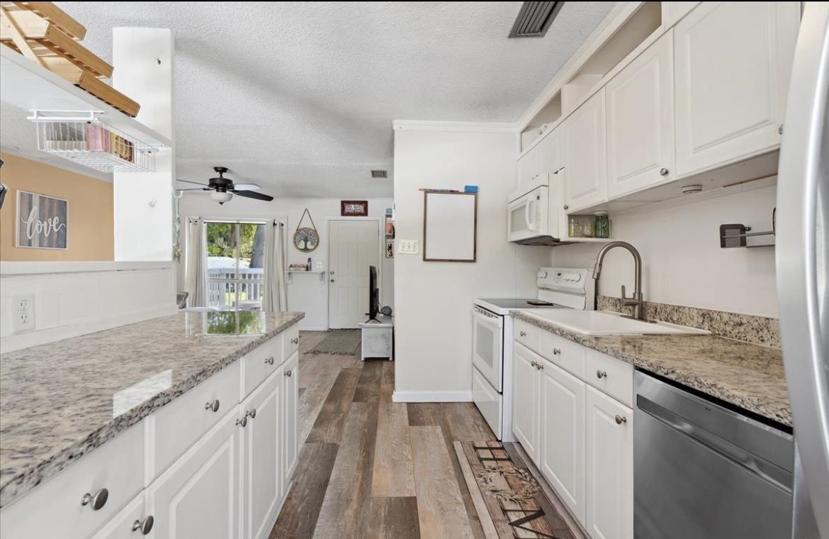 507 Gerona Road St. Augustine, FL 32086 - Photo 4 of 23 a spacious bathroom with a granite countertop sink and a bathtub