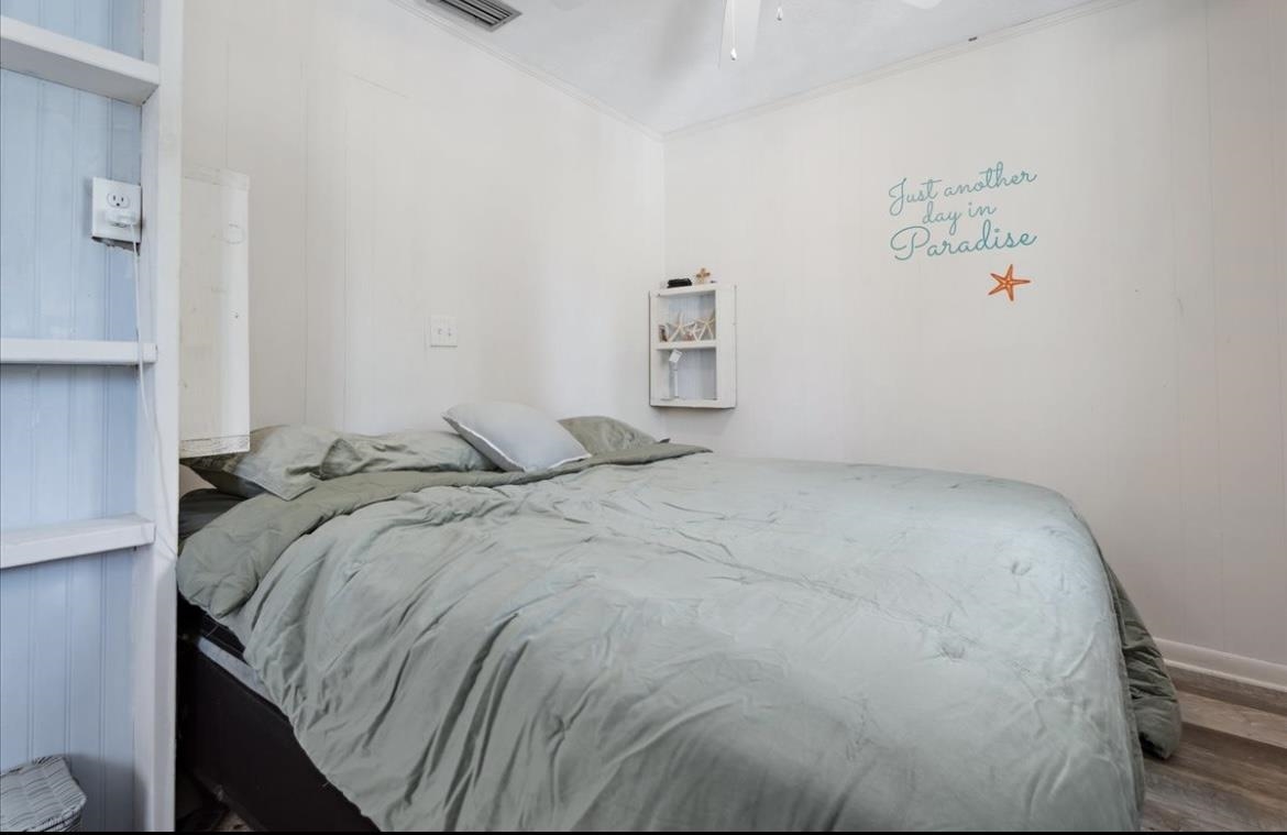 507 Gerona Road St. Augustine, FL 32086 - Photo 6 of 23 a bed sitting in a bedroom next to a window