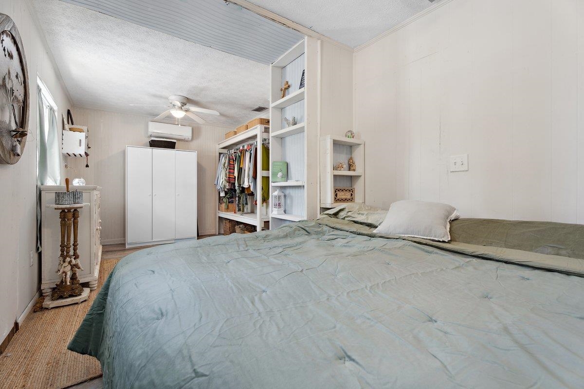 507 Gerona Road St. Augustine, FL 32086 - Photo 8 of 23 a spacious bedroom with a bed and a cabinets