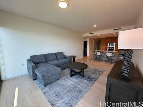 a living room with furniture and a rug