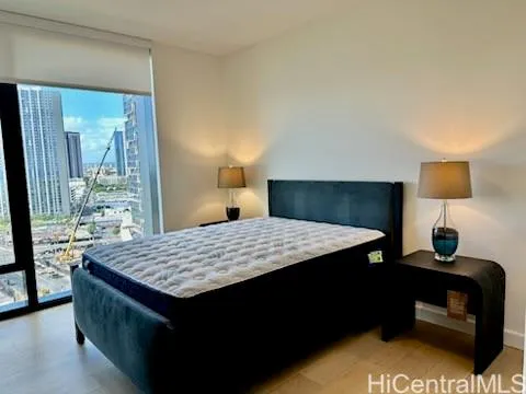 a room with a table chairs and wooden floor