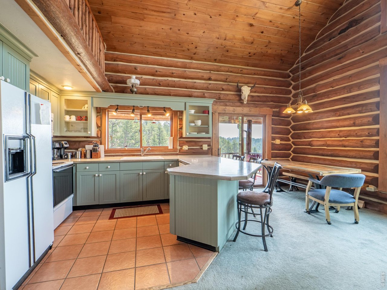 296 Caddo Road Red Feather Lakes, CO 80545 - Photo 10 of 50 Open concept kitchen and dining area.