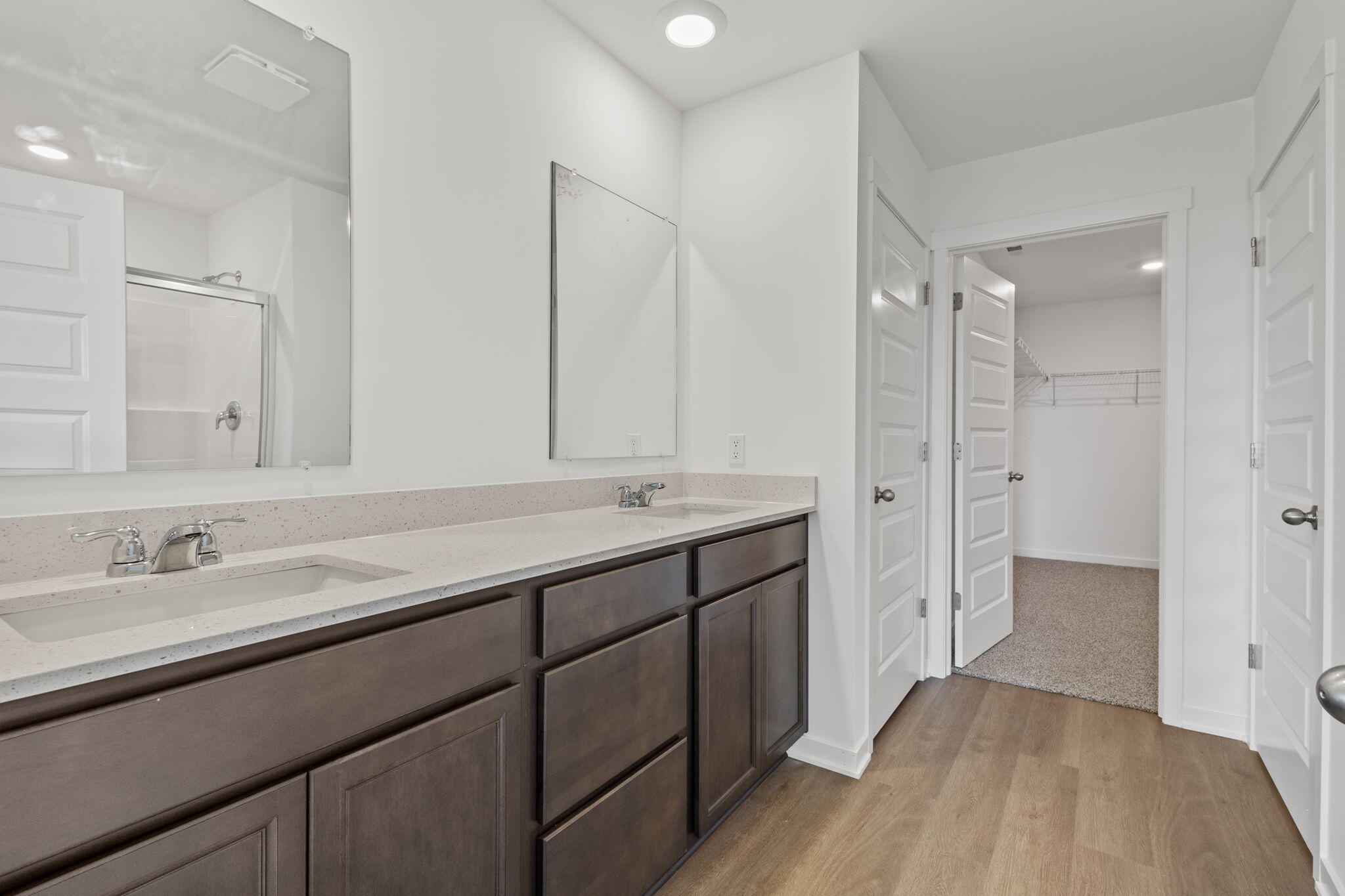 10588 Morse Place Crown Point, IN 46307 - Photo 17 of 28 a bathroom with a double vanity sink mirror and shower