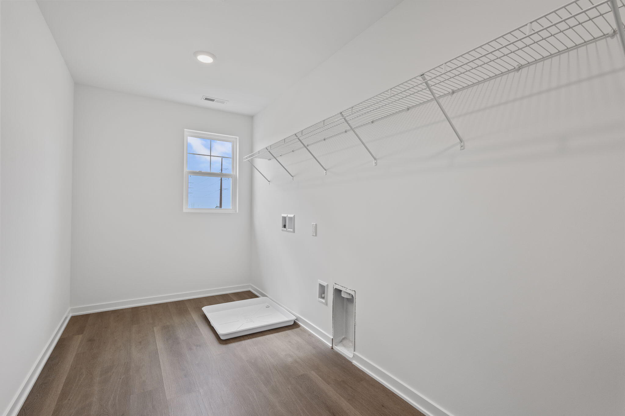 10588 Morse Place Crown Point, IN 46307 - Photo 19 of 28 a view of a room with wooden floor and white walls