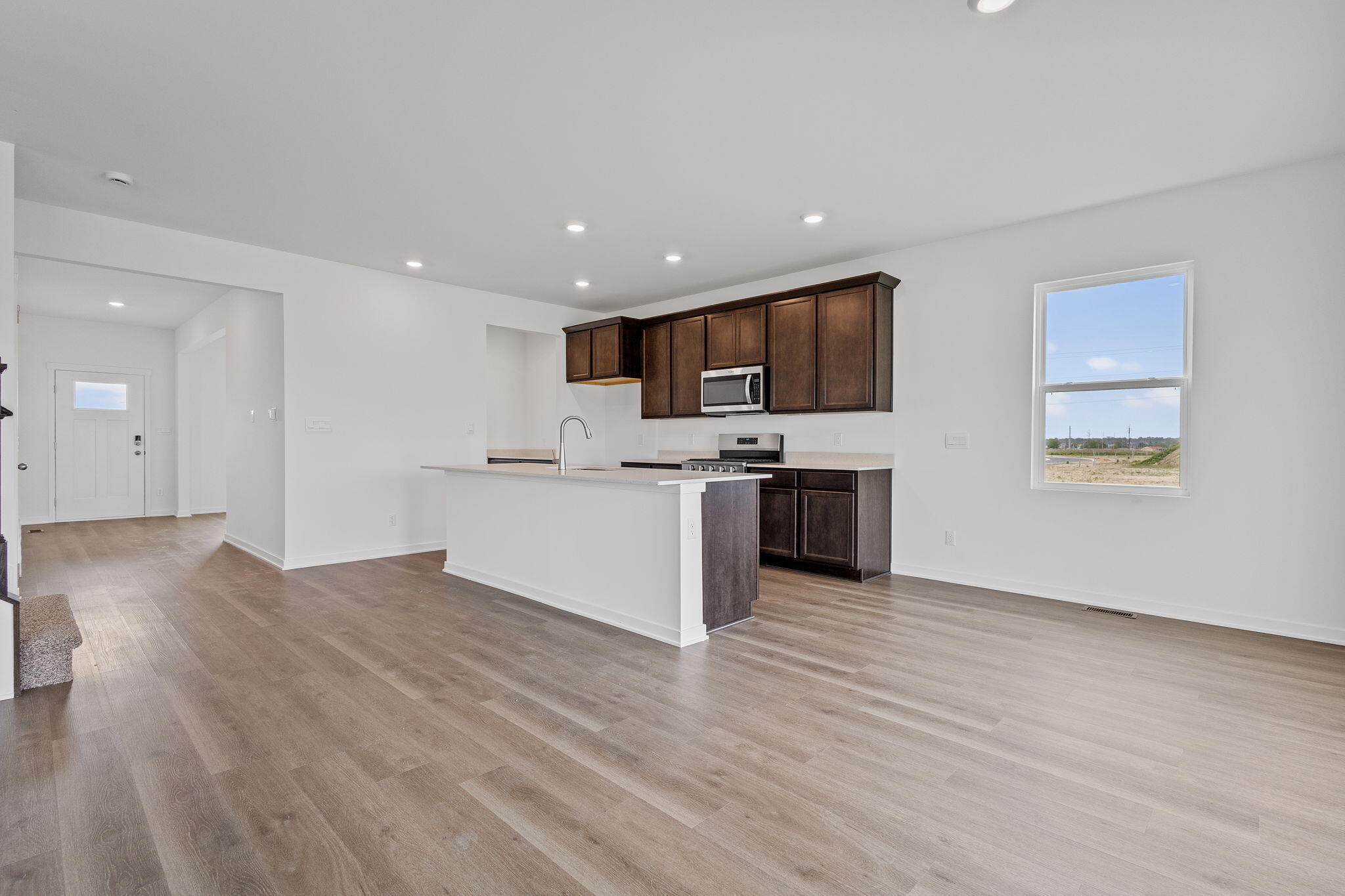 10588 Morse Place Crown Point, IN 46307 - Photo 6 of 28 a view of kitchen with wooden floor and electronic appliances
