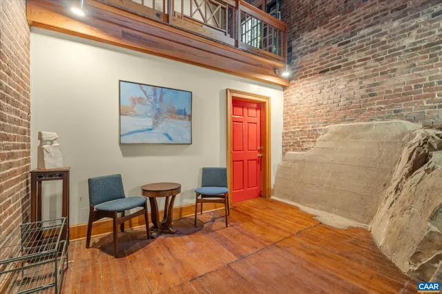a view of gallery with wooden floor
