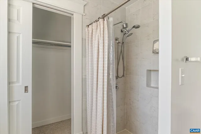 a view of a yard with wooden fence