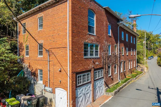 a front view of a house with parking