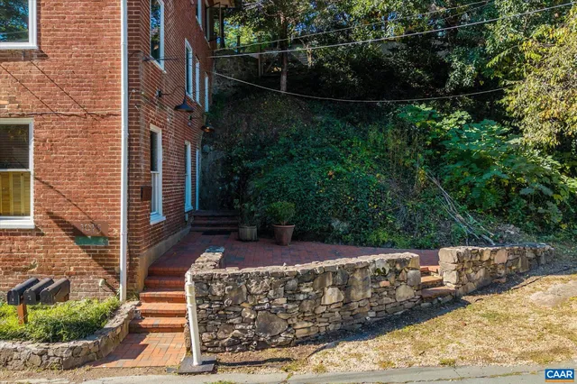 a view of a backyard with pathway
