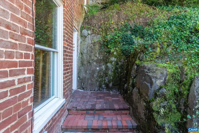 a bathroom with a toilet and a shower curtain