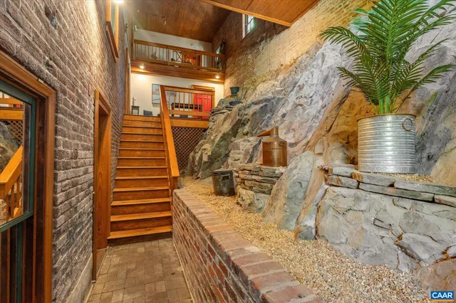 a view of a house with chairs and stairs