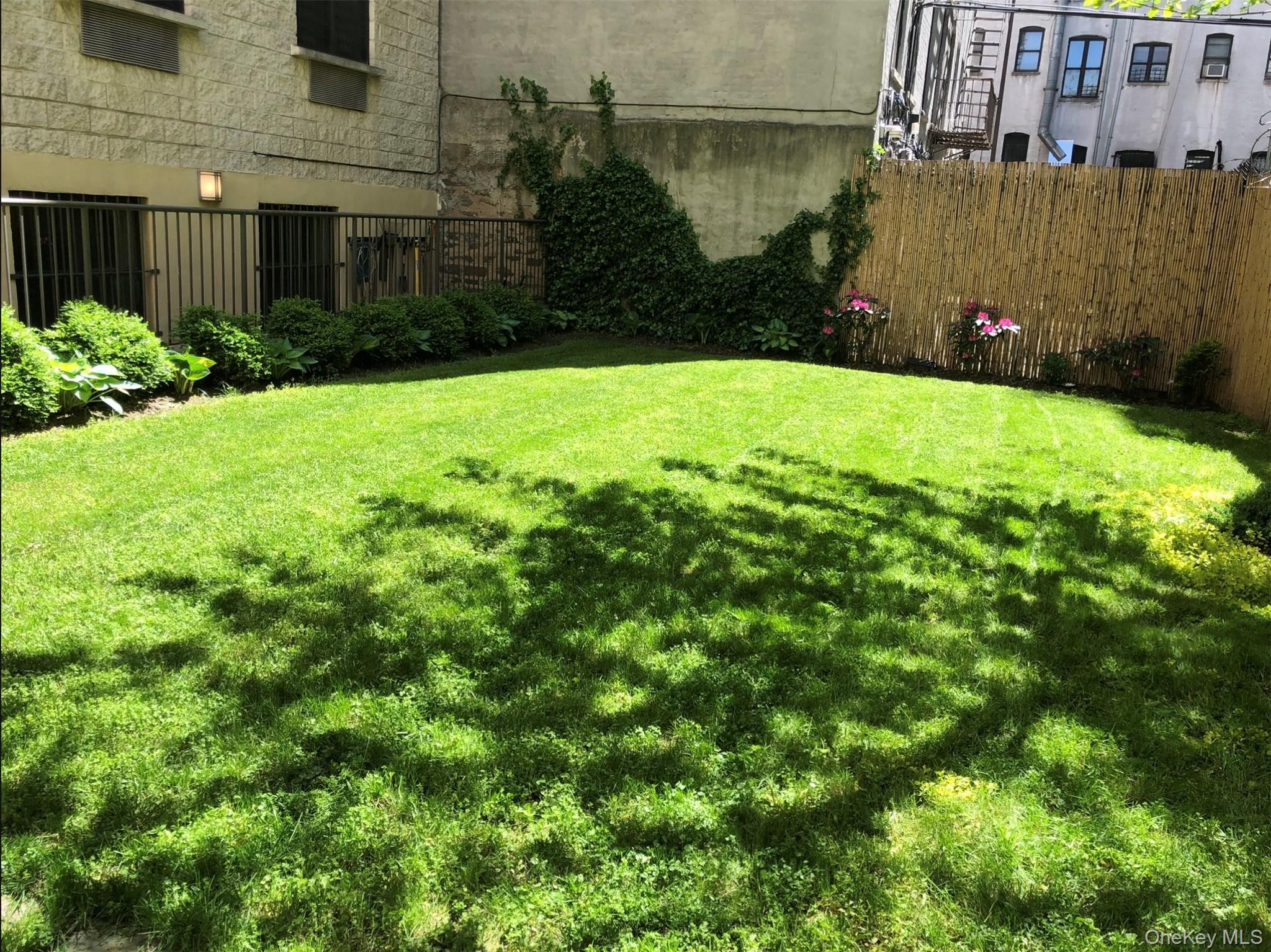 108 Odell Clark Place, Unit 5C Manhattan, NY 10030 - Photo 11 of 15 a view of a back yard of the house