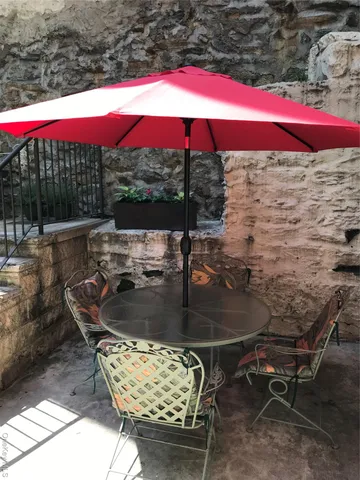 a view of a swimming pool with a yard