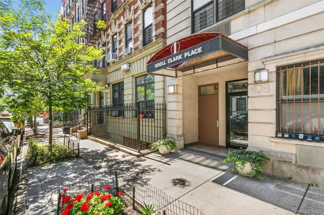 a view of a brick building with many windows