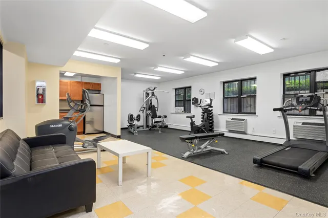 a view of a living room with gym equipment