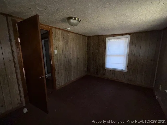 a view of room with hardwood floor