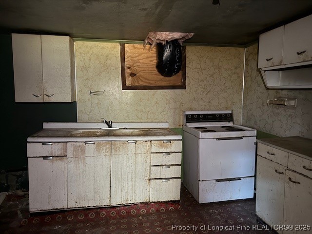 435 West Connecticut Avenue Southern Pines, NC 28387 - Photo 25 of 35 a kitchen with a stove and cabinets
