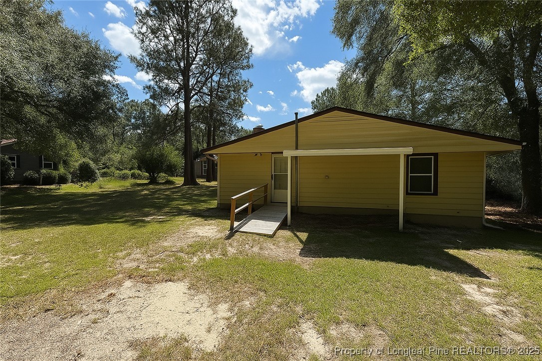 435 West Connecticut Avenue Southern Pines, NC 28387 - Photo 34 of 35 a view of a house with backyard and trees