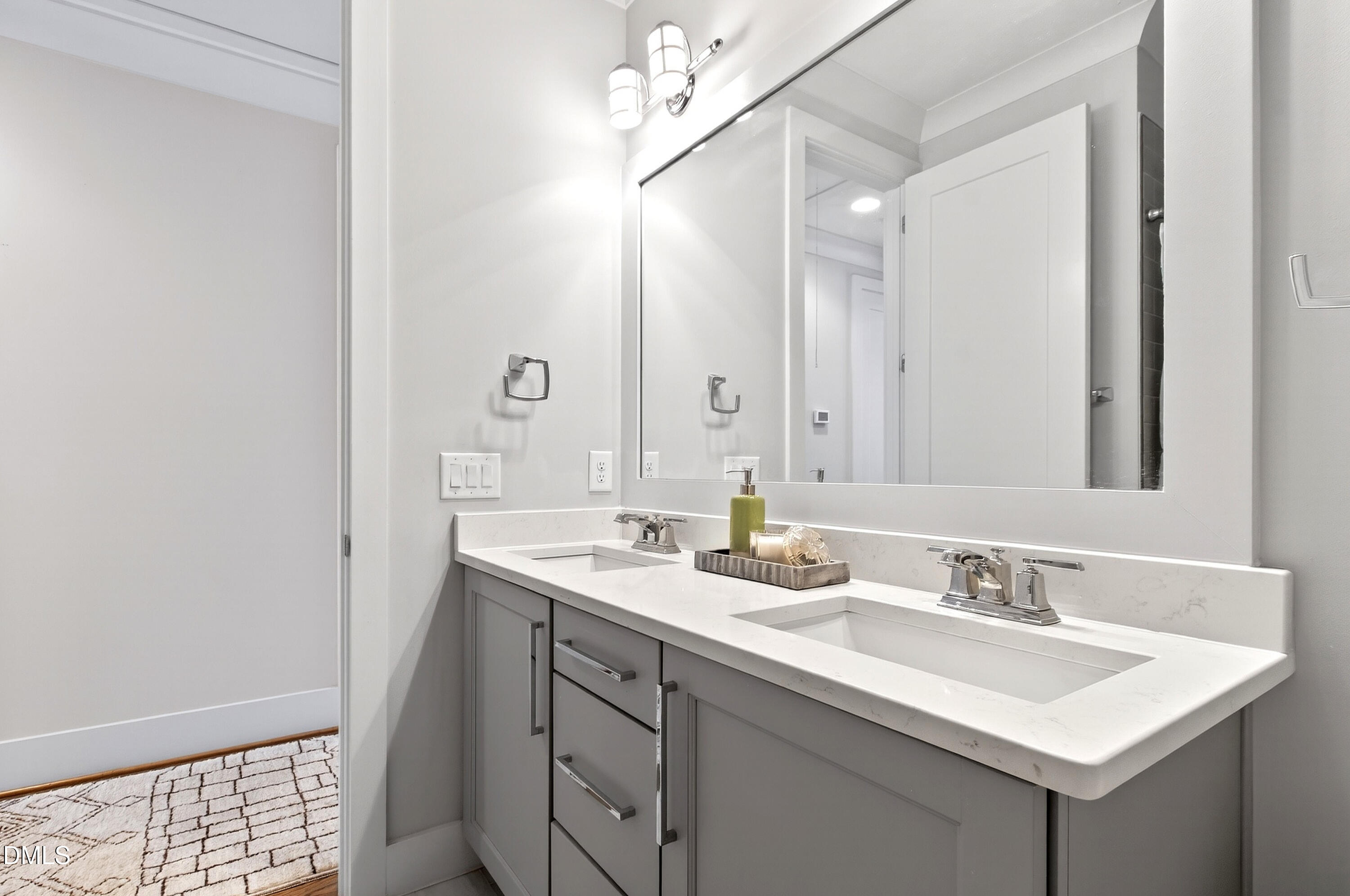 1116 Hymettus Court Raleigh, NC 27607 - Photo 50 of 69 a bathroom with a sink and a mirror