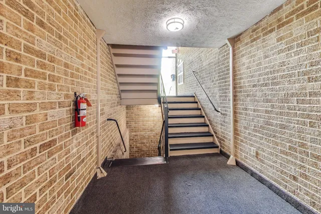 a view of a staircase and white walls