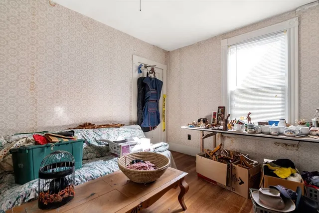 a room with furniture and a wooden floor