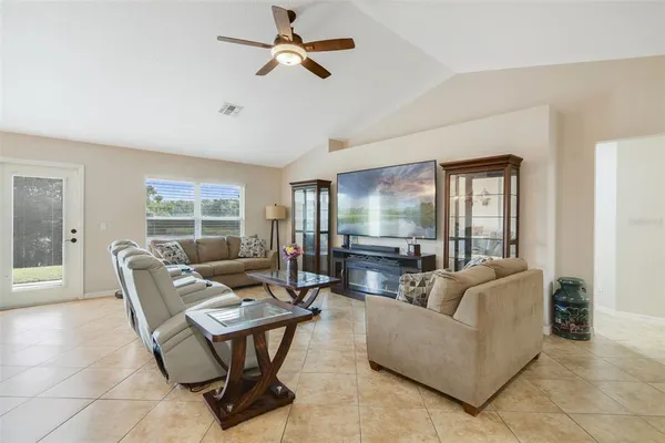 a living room with furniture and a large window