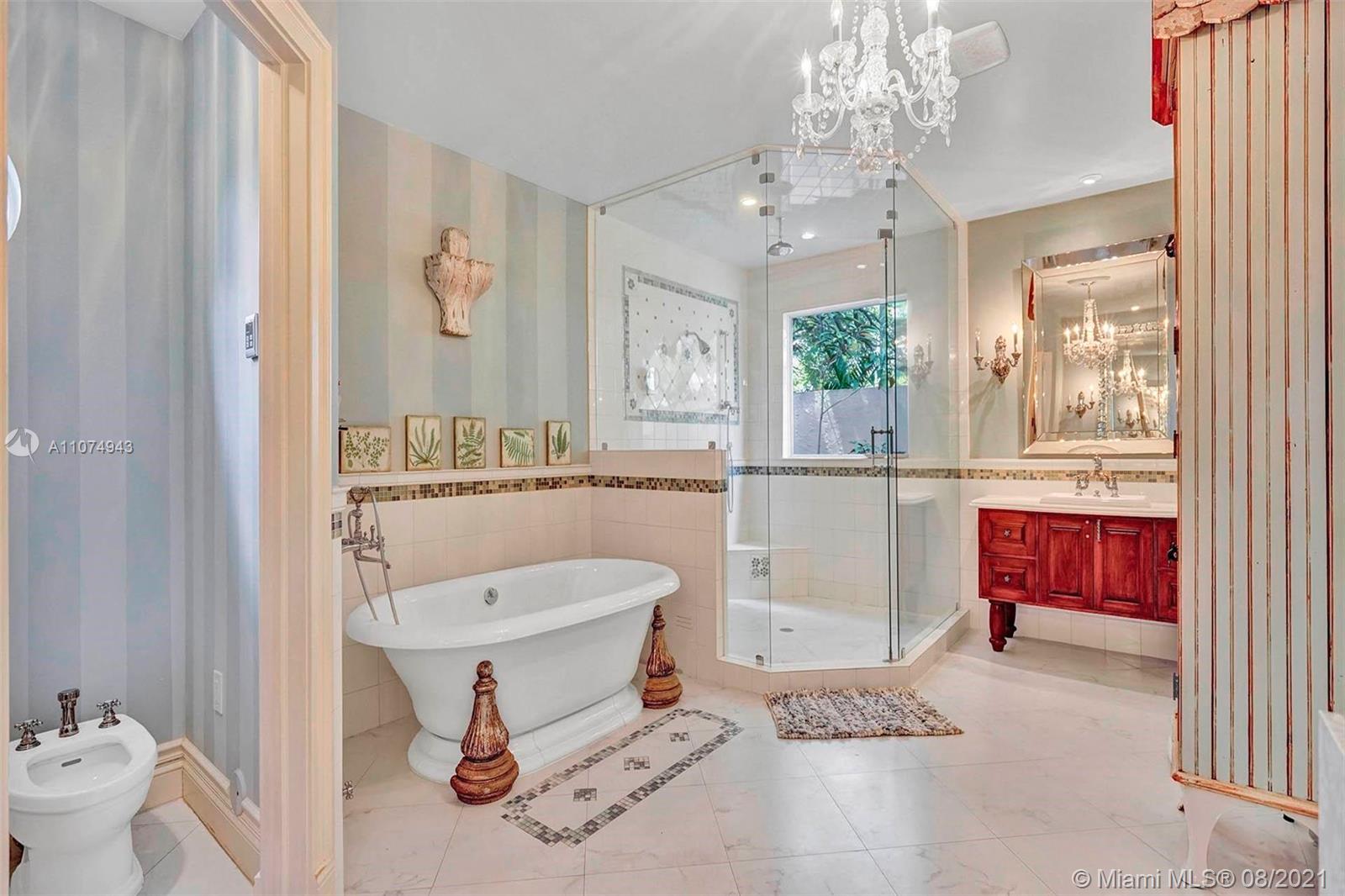 2705 Hackney Road Weston, FL 33331 - Photo 14 of 71 a bathroom with a sink a toilet and mirror