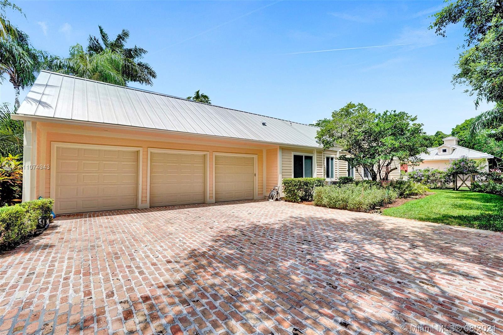 2705 Hackney Road Weston, FL 33331 - Photo 50 of 71 a front view of a house with a yard and a garage